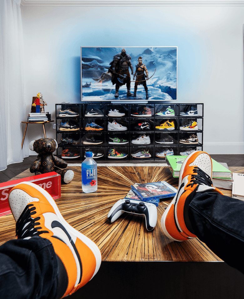 Man Sitting and Admiring His Sneakers Stored in Crep Protect 3.0 sneaker box